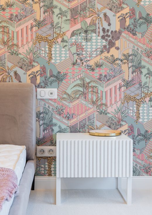 Modern bedroom with a soft pastel botanical mural wallpaper feature wall